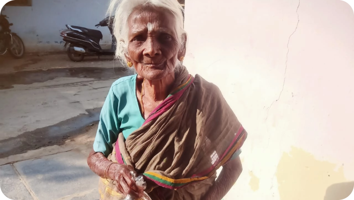 Foundation volunteers distributing food packages to elderly villagers